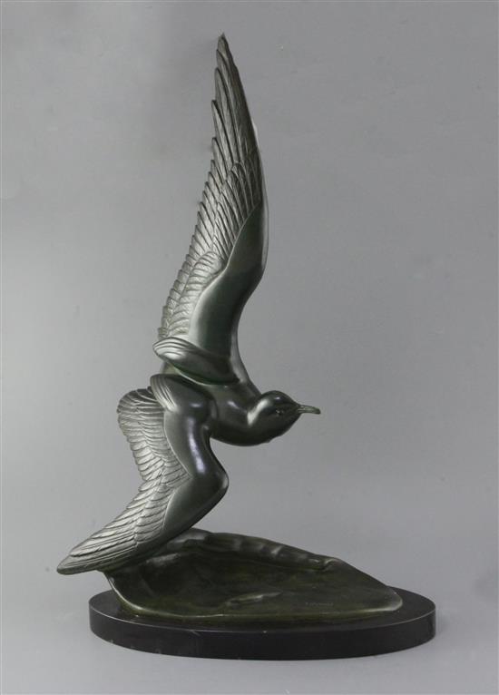 Irénée Rochard (1906-1984). A French Art Deco green patinated bronze model of a seagull flying over a wave, height 28in.
